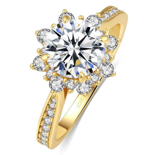 Gold ring with a large central diamond and smaller diamonds on a white background